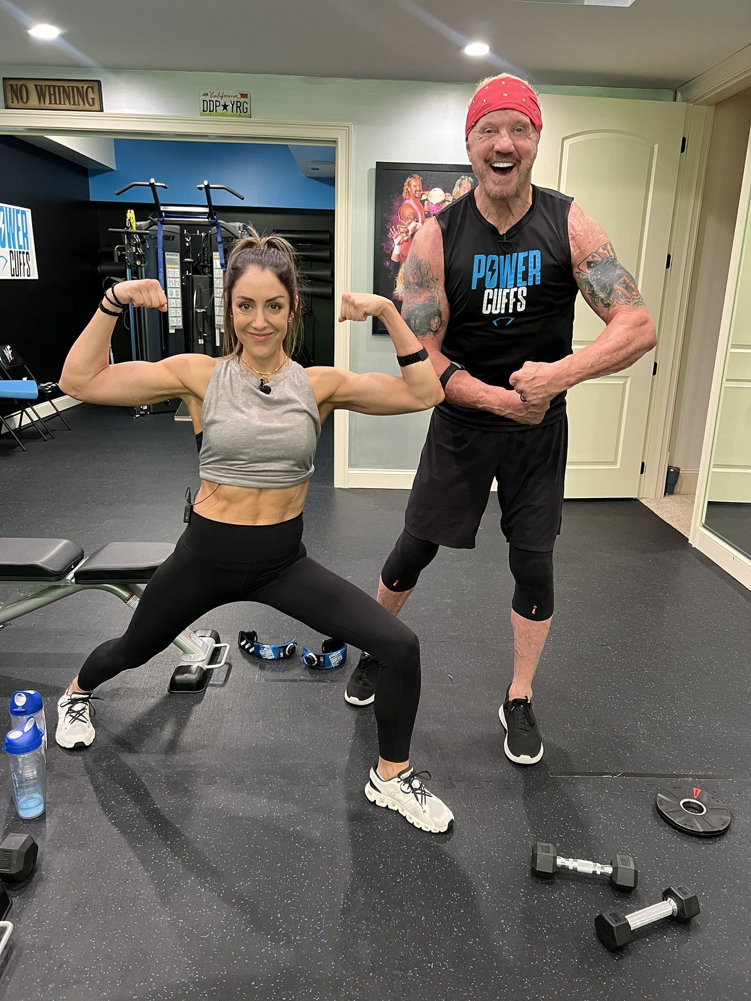 Britt Baker and DDP posing after a workout