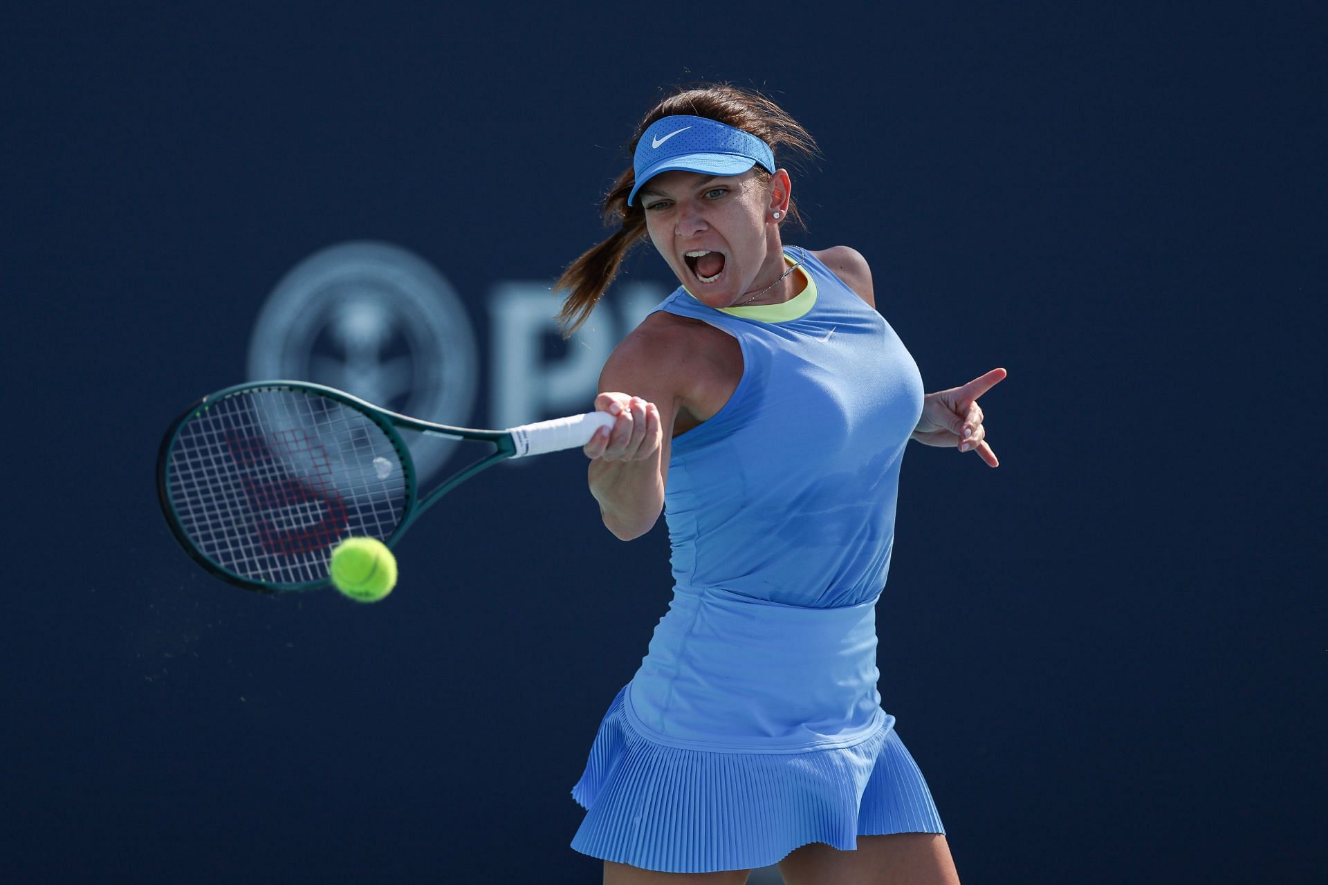 Simona Halep hits a forehand at the 2024 Miami Open