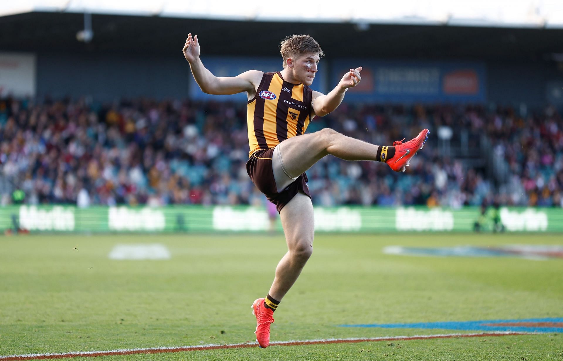 Dylan Moore of the Hawks kicks the ball