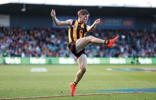 Dylan Moore of the Hawks kicks the ball