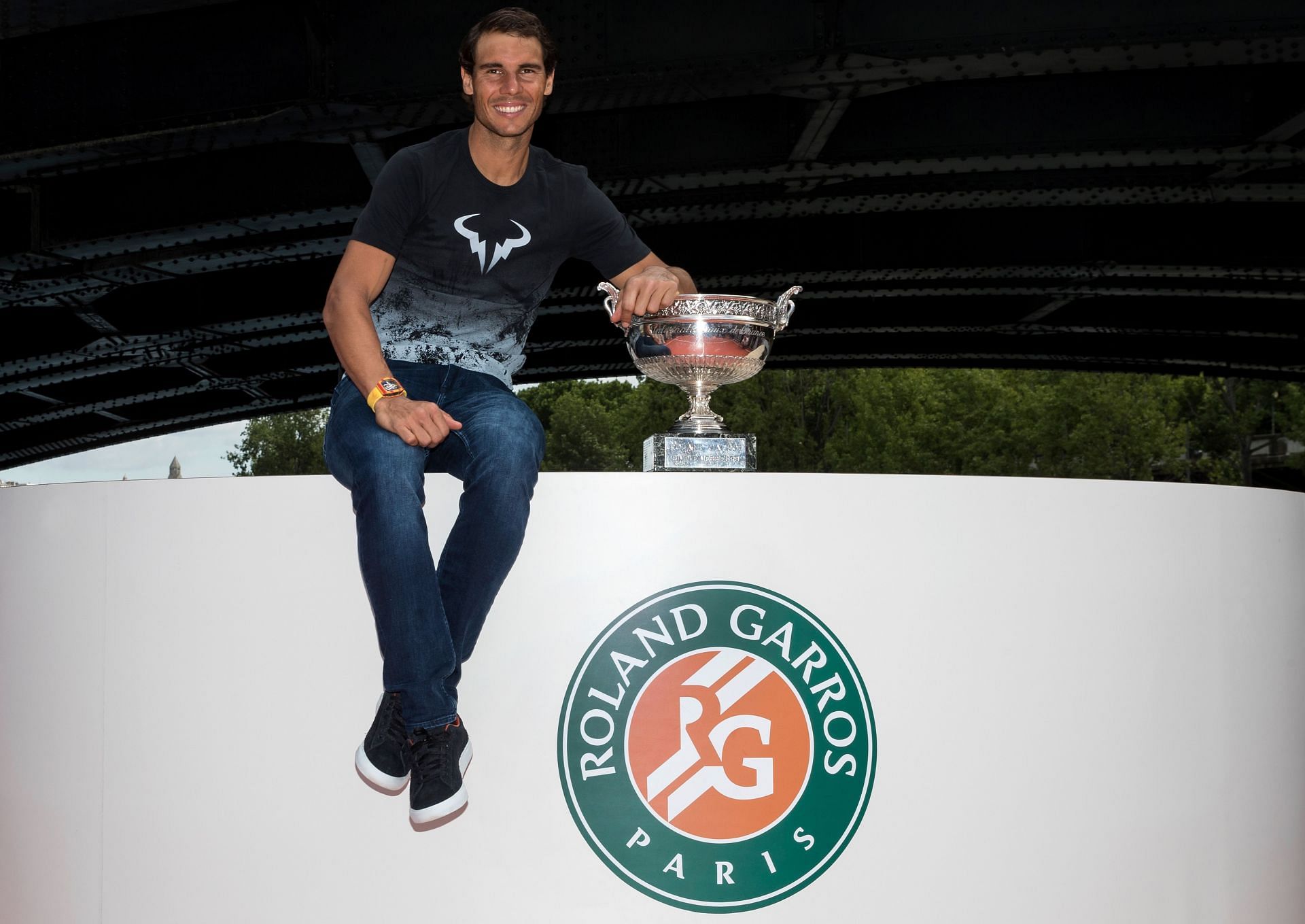 Rafael Nadal poses for pictures after his record-breaking 10th French Open title