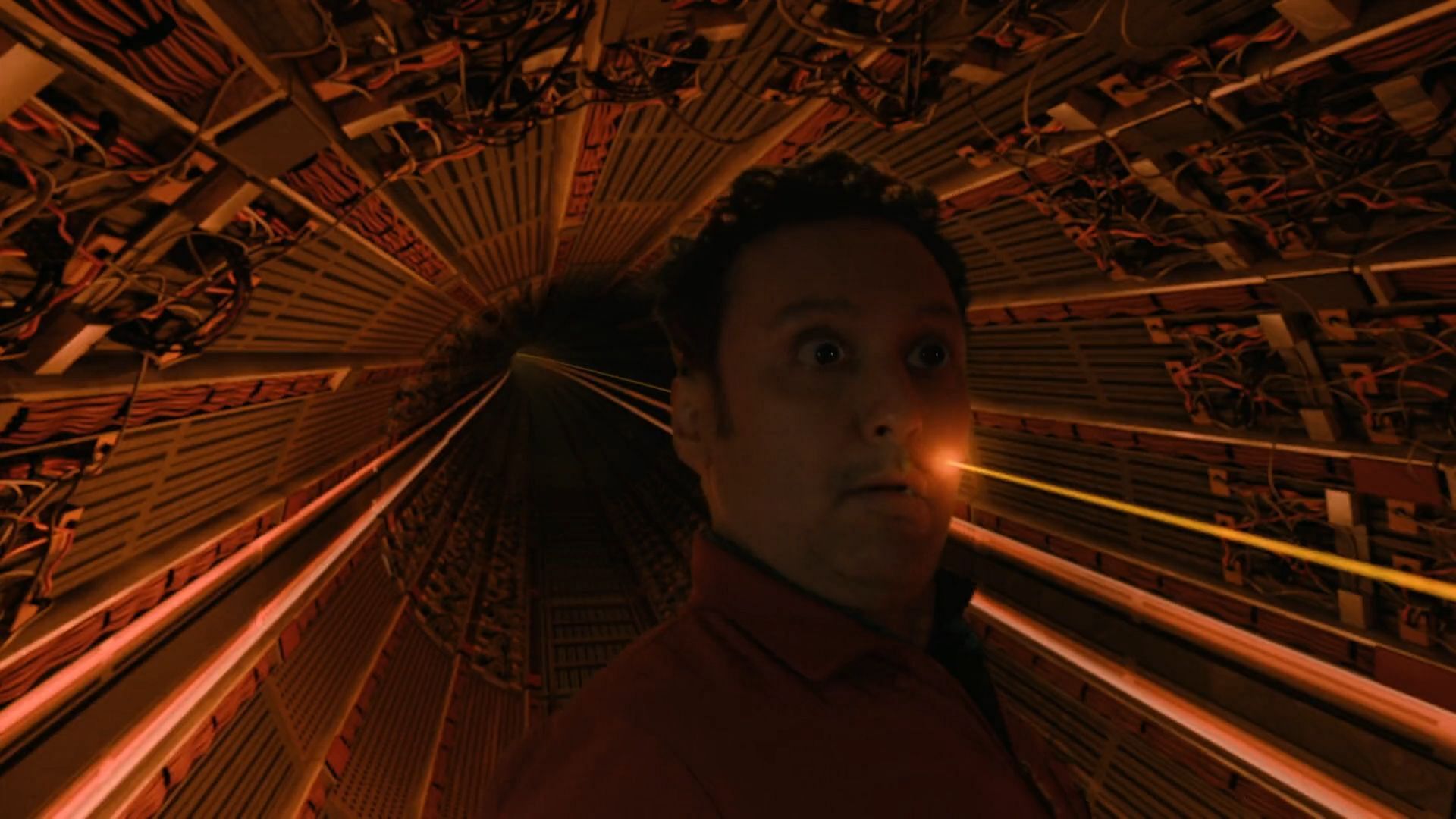Ben being hit by a beam inside the particle accelerator, as seen in Evil season 4 episode 1 (Image via Paramount+)