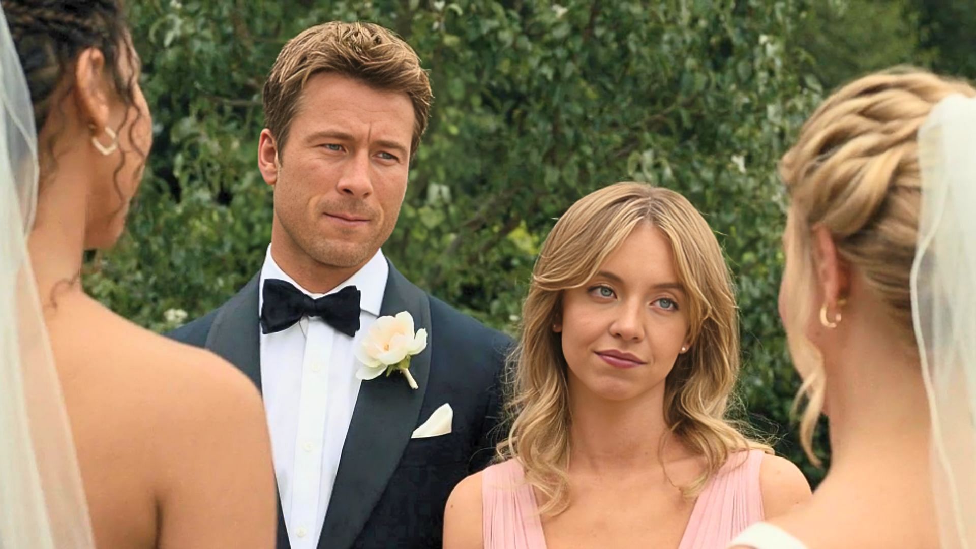  Glen Powell (left) and Sydney Sweeney (right) in a still from Anyone But You (Image via Netflix)