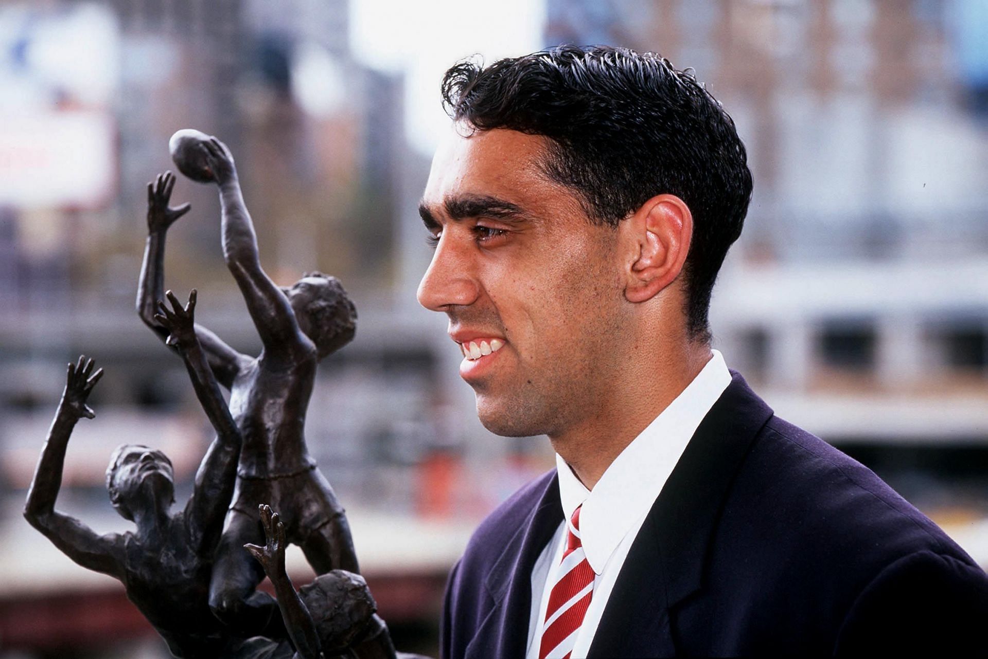 Adam Goodes, of the Sydney Swans, Winner of the 1999 Norwich Rising Star, with his trophy.