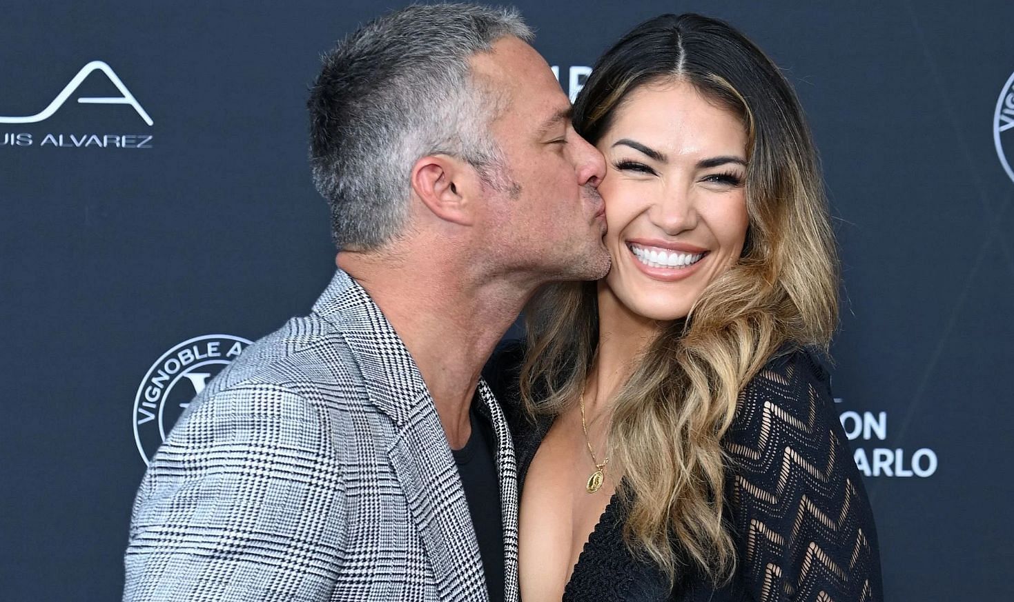 Taylor Kinney ties the knot with long-time girlfriend, Ashley Cruger. (Image via Pascal Le Segretain/Getty Images)