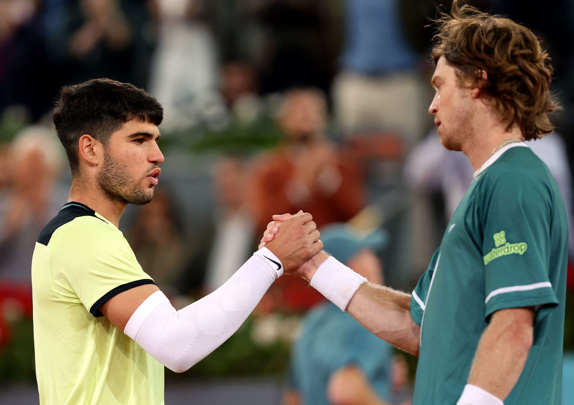 Carlos Alcaraz (L) and Andrey Rublev (R) after the conclusion of their Madrid Open quarterfinal