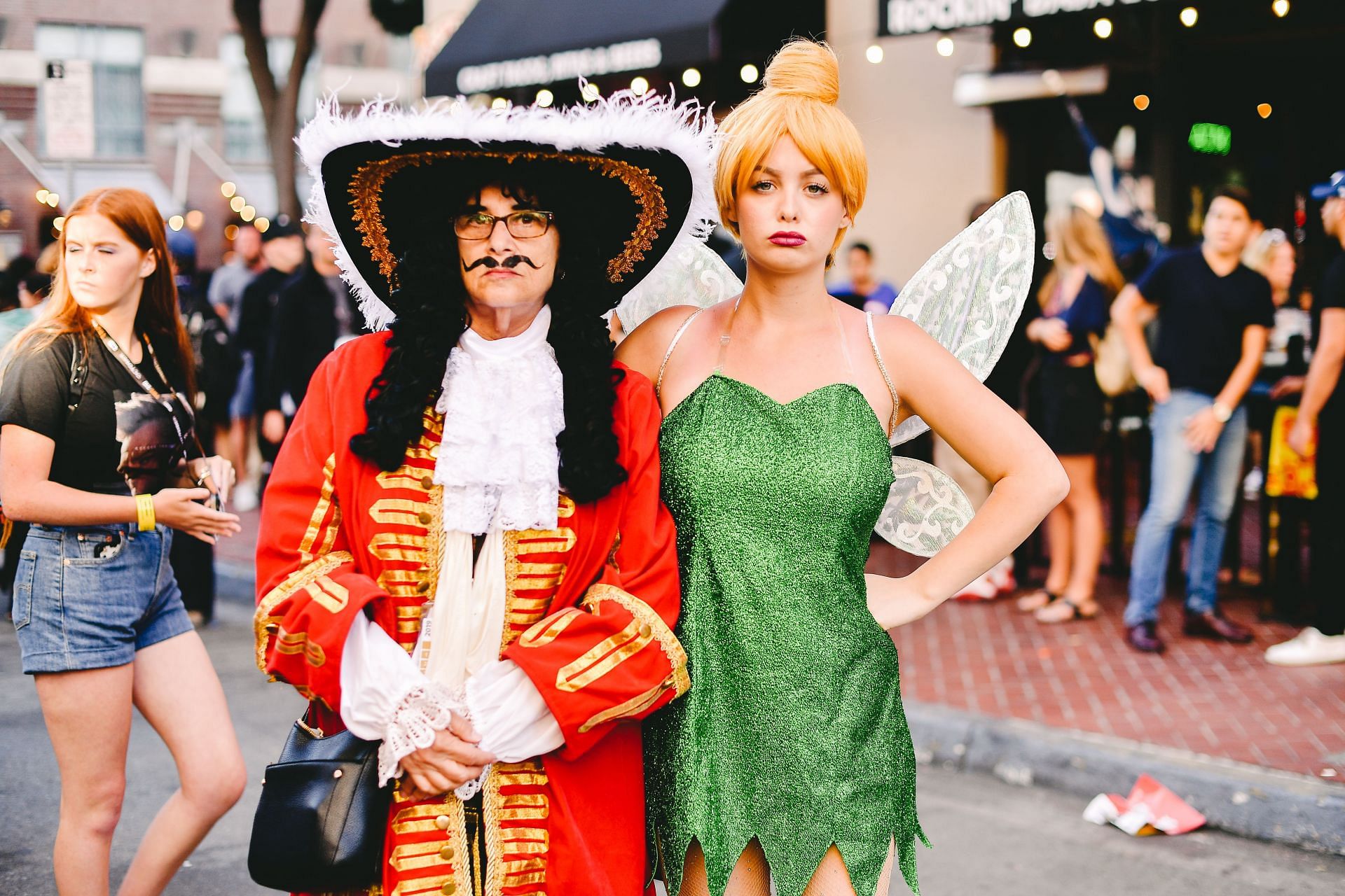 Cosplayers dressed as Hook and Tinker Bell (Image via Getty/Matt Winkelmeyer)