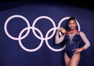 Suni Lee poses with her medal after winning the Women's All-Around Final at the 2020 Olympic Games in Tokyo, Japan.
