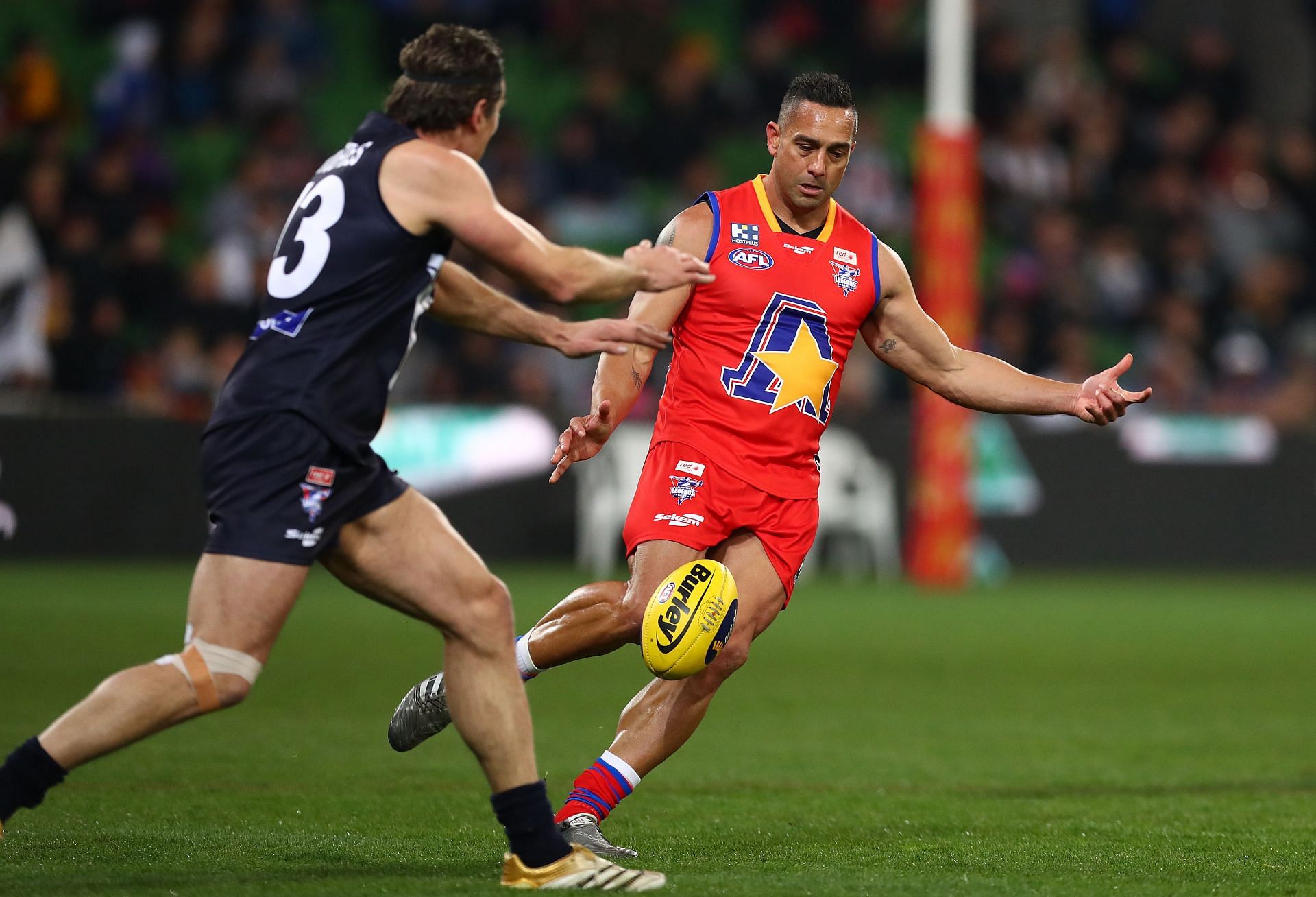 Andrew McLeod of the All-Stars kicks the ball during the EJ Whitten Legends Match