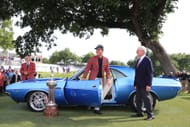Kevin Na poses with a 1973 Dodge Challenger after winning at the Colonial in 2019