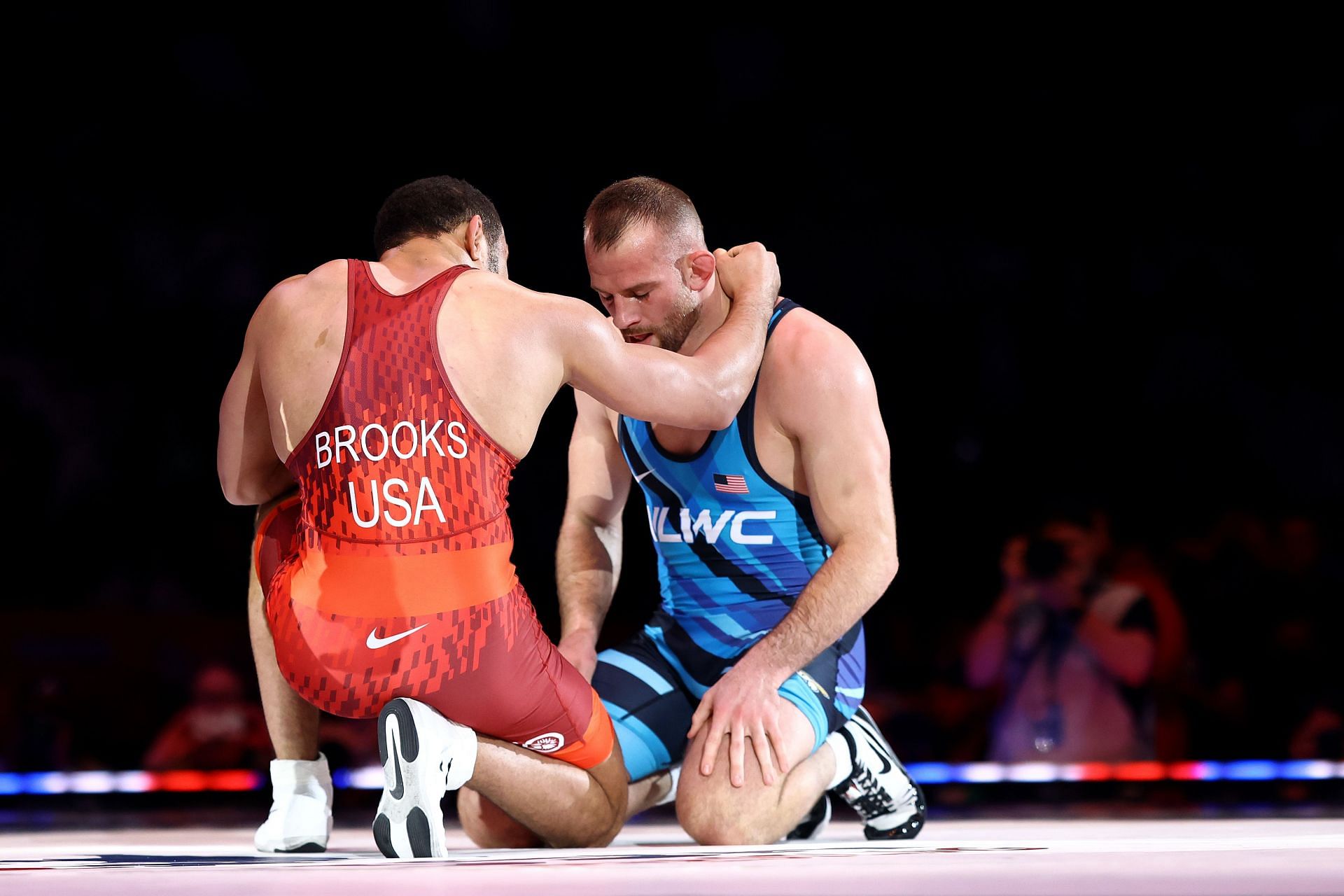Aaron Brooks and David Taylor console each other after Brooks wins the men&#039;s freestyle 86-KG division final during the US Olympic Wrestling Trials.
