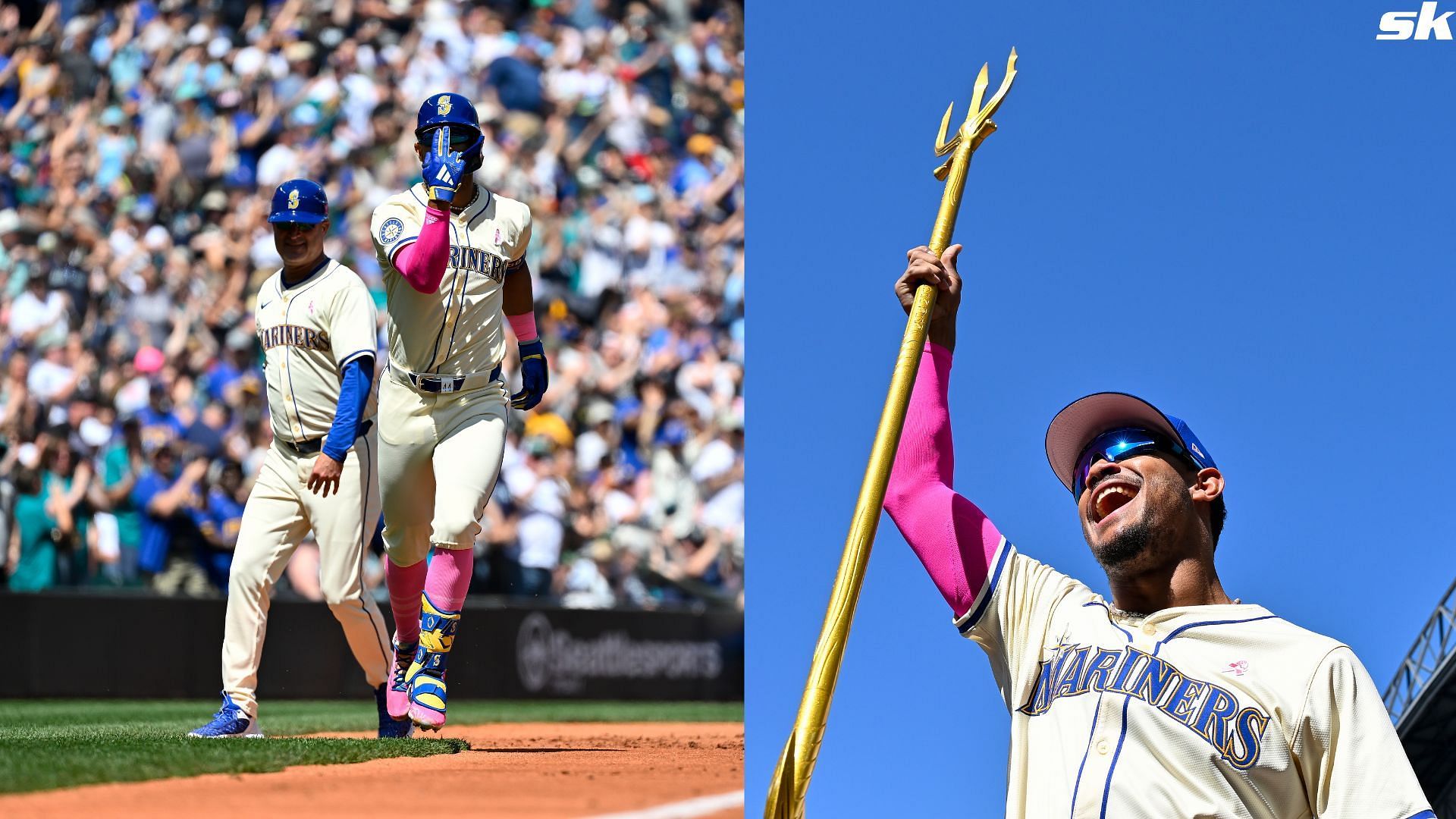 Julio Rodriguez of the Seattle Mariners holds up the team trident after the game against the Oakland Athletics at T-Mobile Park