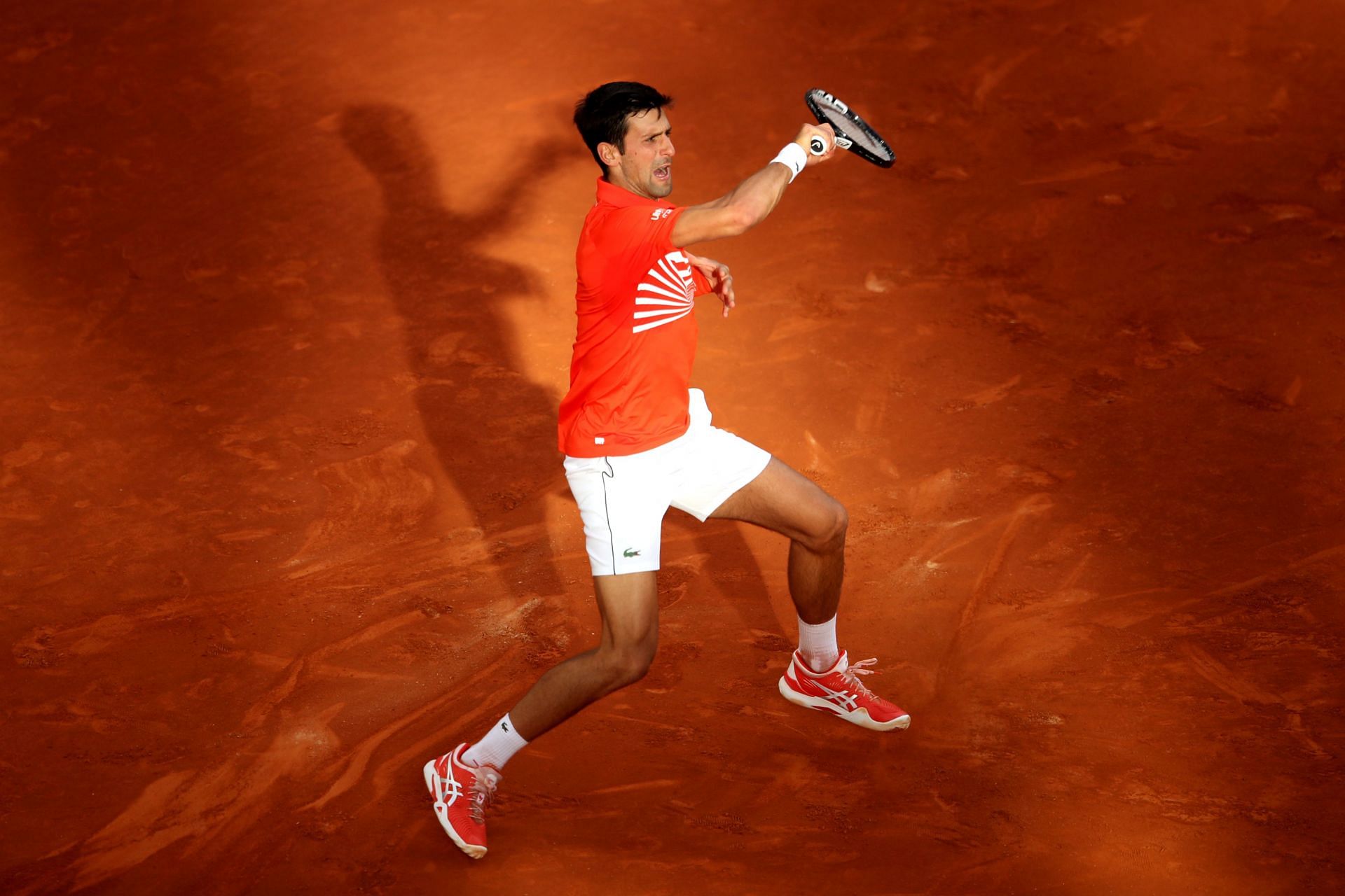 Novak Djokovic hits a forehand at the 2019 Madrid Open.