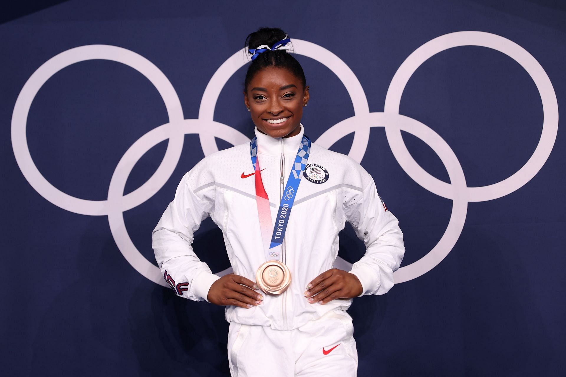Simone Biles poses with the bronze medal following the Women&#039;s Balance Beam Final at the 2020 Olympic Games in Tokyo, Japan.