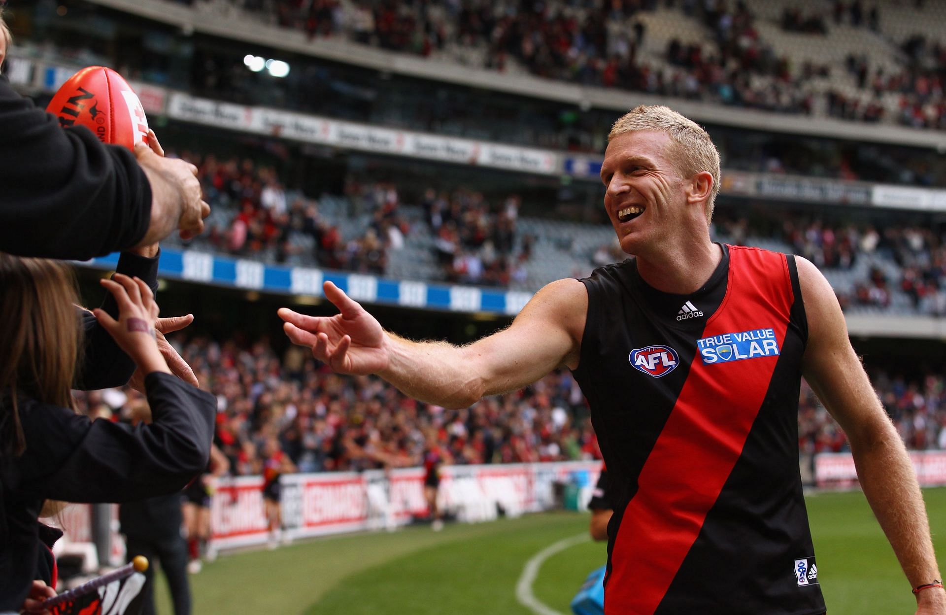 Dustin Fletcher of Bombers acknowledges the fans