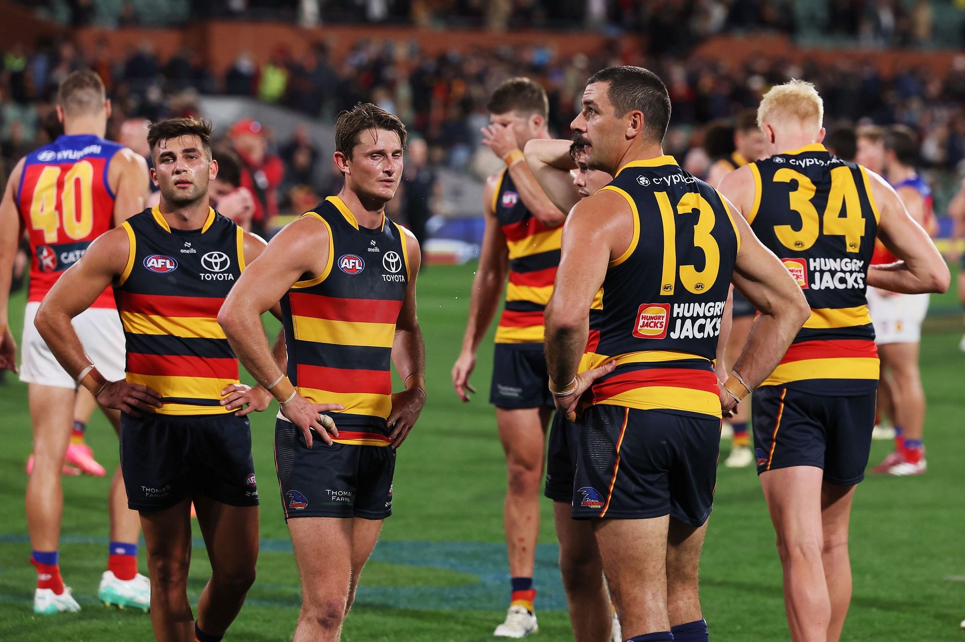 Adelaide players react after the draw