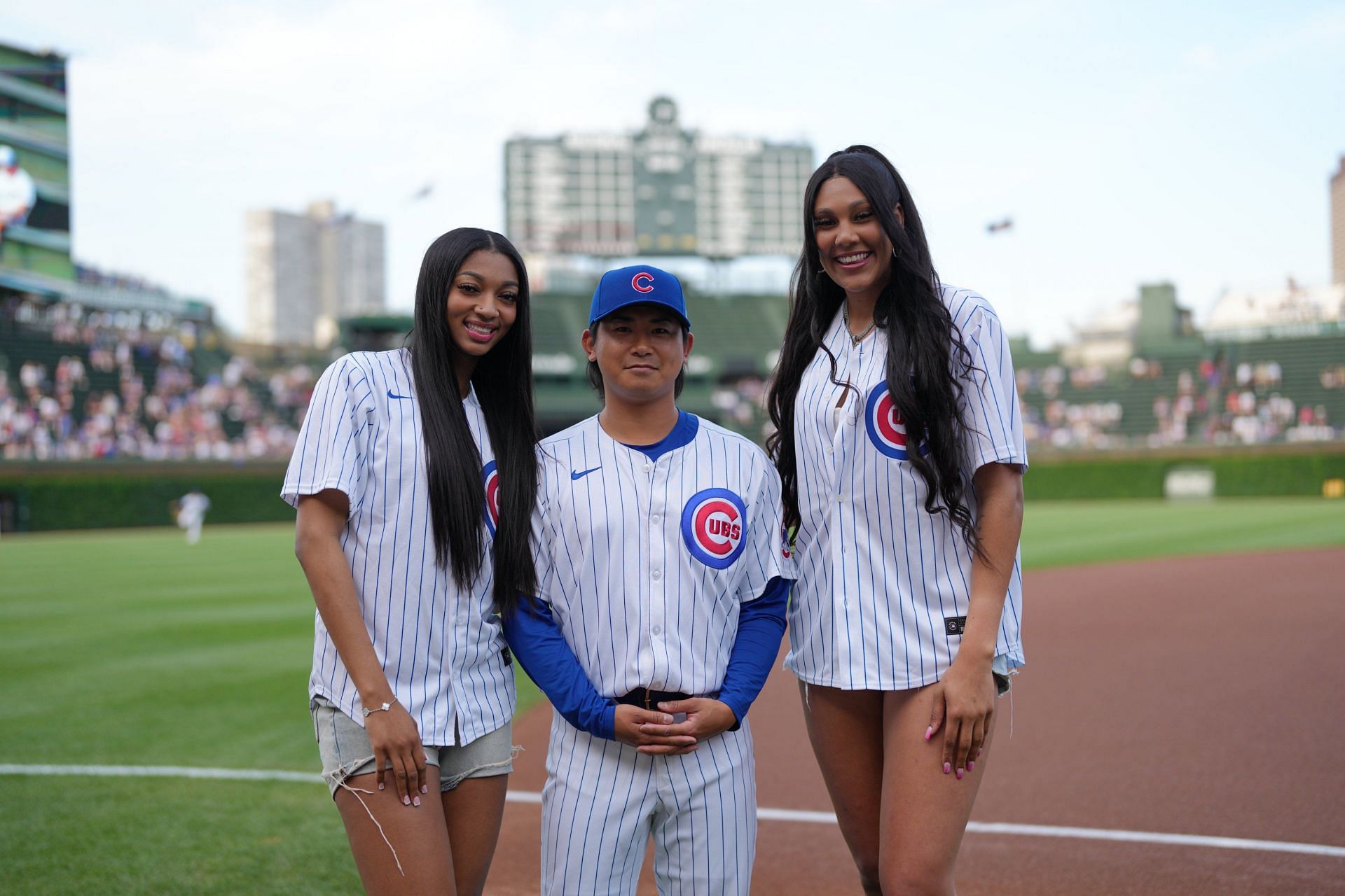 Angel Reese &amp; Kamilla Cardoso get Cubs fans hyped with their first pitch alongside Shota Imanaga