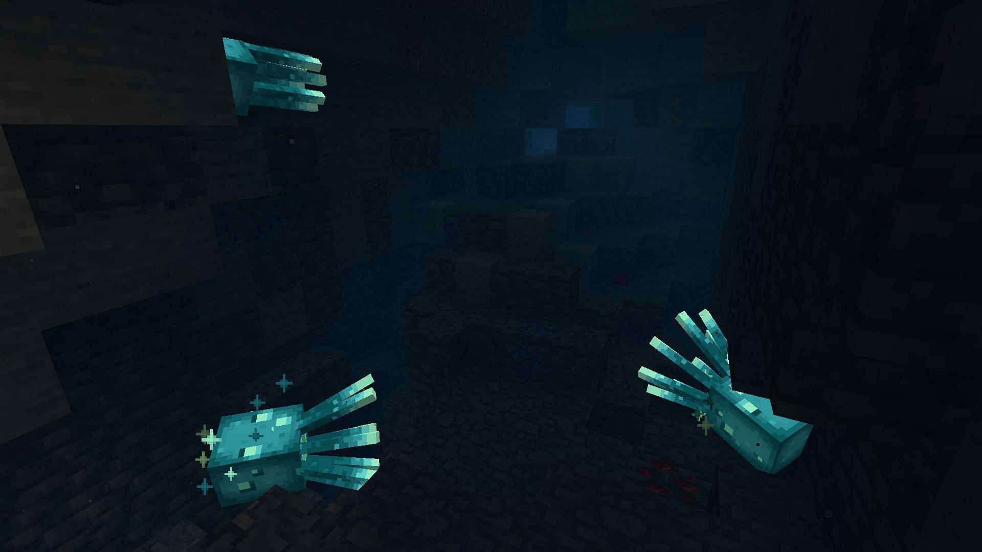 Glow squids &quot;lighting&quot; up an underwater cave (Image via Mojang)