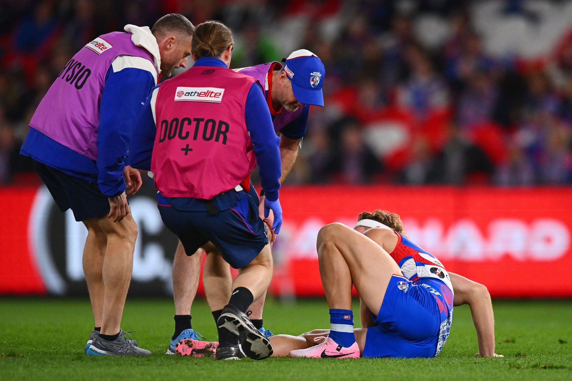 Aaron Naughton of the Bulldogs reacts to an injury during the round 11 AFL match between Western Bulldogs and Sydney Swans
