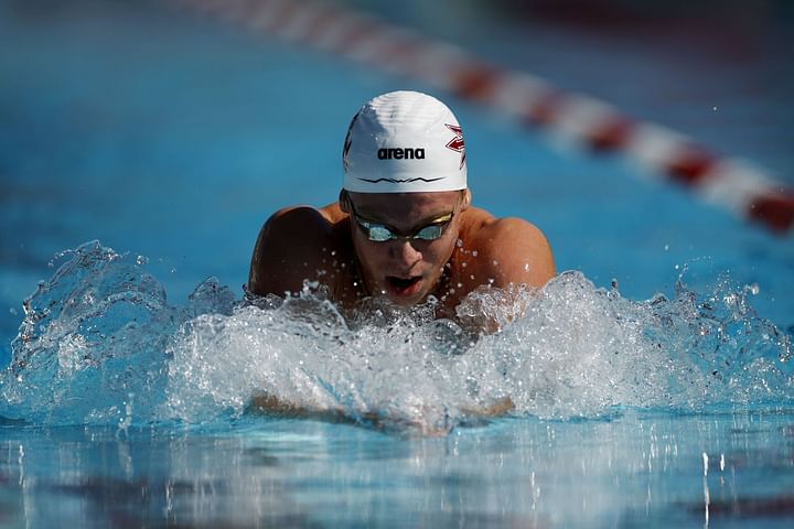 Leon Marchand breaks 100m breaststroke meet record at Speedo Grand ...