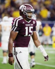 Myles Garrett walks toward the sideline between plays in a game between Arizona and Texas A&M