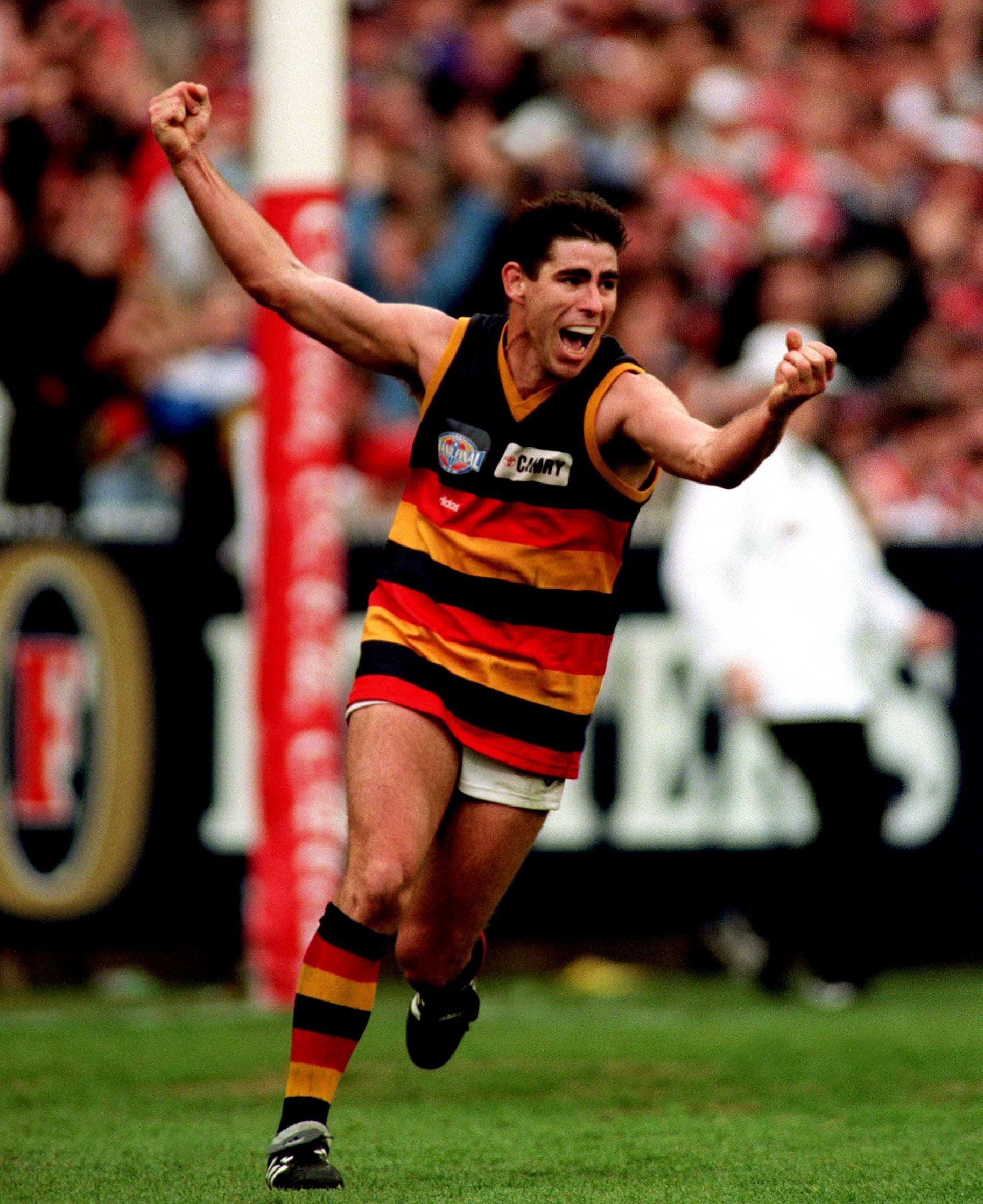 Darren Jarman #3 for Adelaide celebrates kicking a goal in the 1997 AFL Grand Final