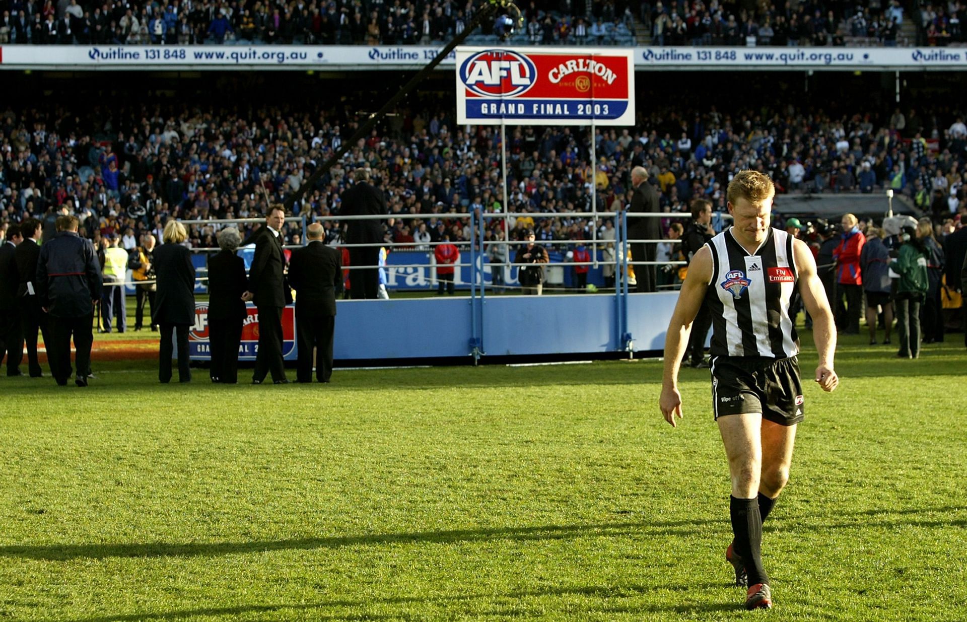 Magpies captain Nathan Buckley walks away from the dias after giving his runner up speech after the AFL Grand Final