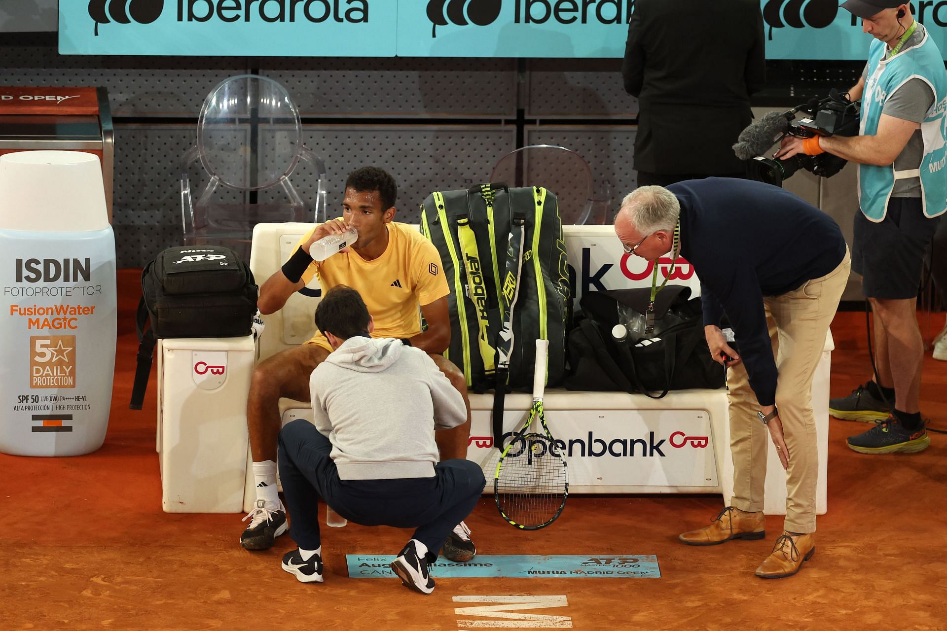 Felix Auger-Aliassime receives treatment during his final against Andrey Rublev at the 2024 Madrid Open.