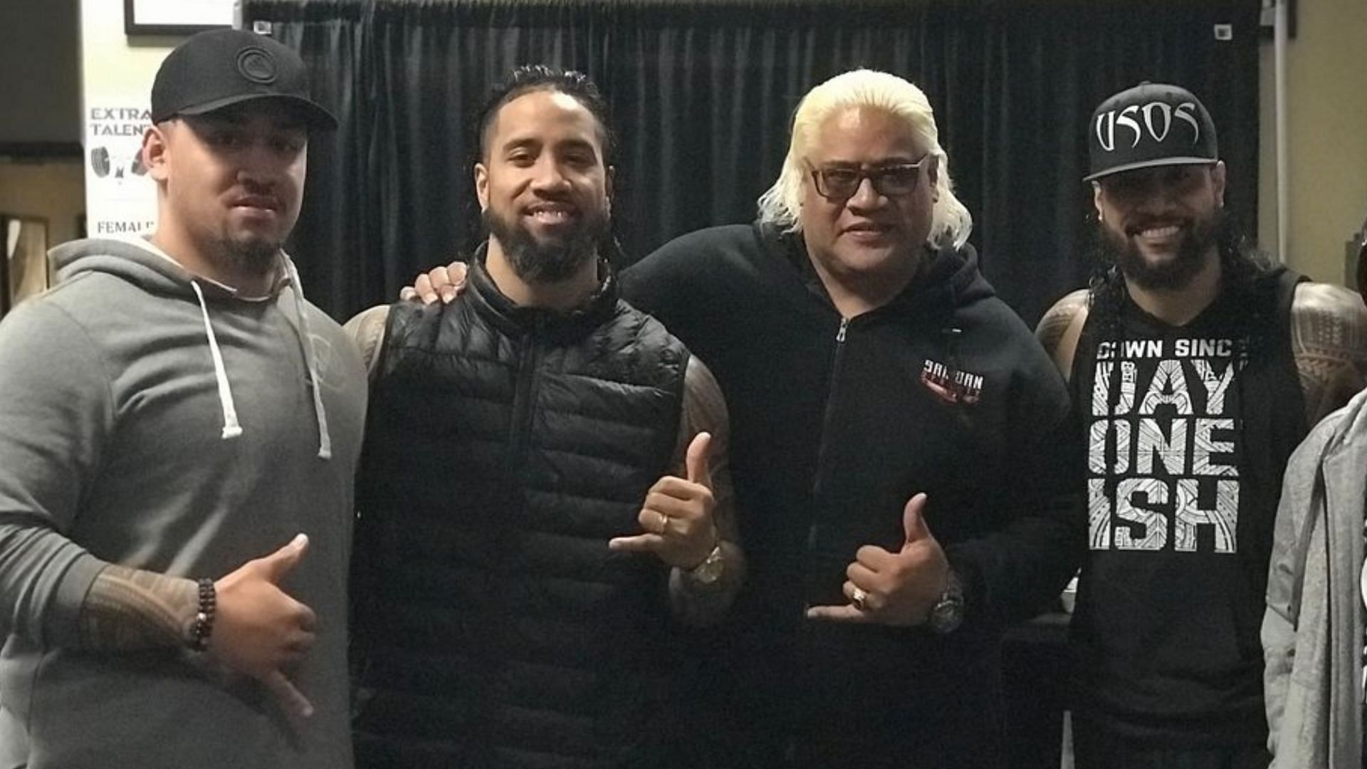 WWE Hall of Famer Rikishi with his sons, Jimmy Uso, Jey Uso, and Solo Sikoa