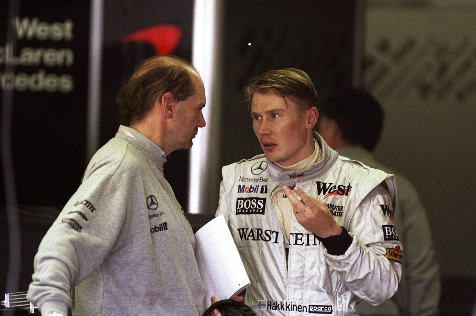 Adrian Newey in conversation with Mika Hakkinen of McLaren, 1998 Canadian GP (Credit: Mike Cooper /Allsport)