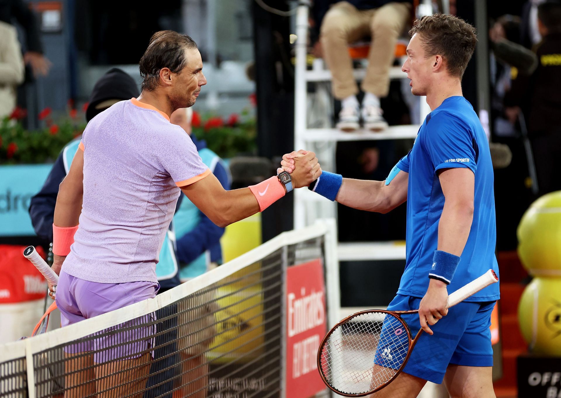 Rafael Nadal (L) and Jiri Lehecka shake hands after their Madrid Open 4R match