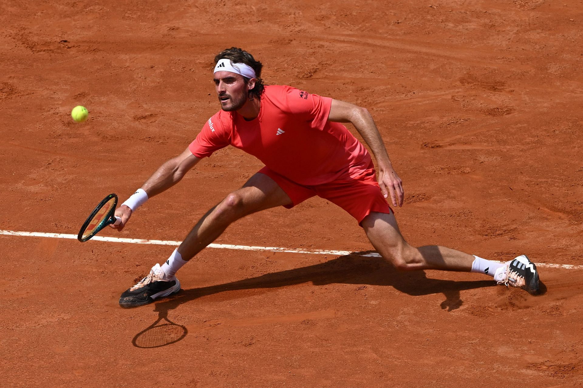 Stefanos Tsitsipas retrieves a ball during his Italian Open 3R match