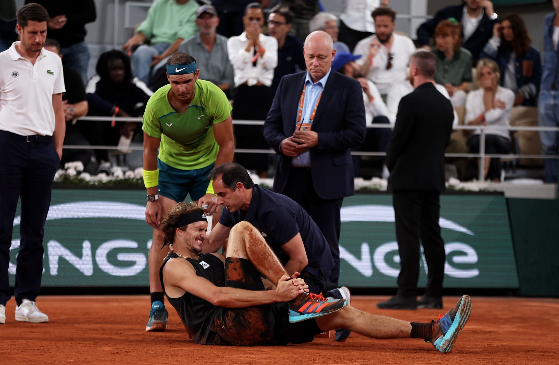 Nadal looks over an injured Zverev at the 2022 French Open