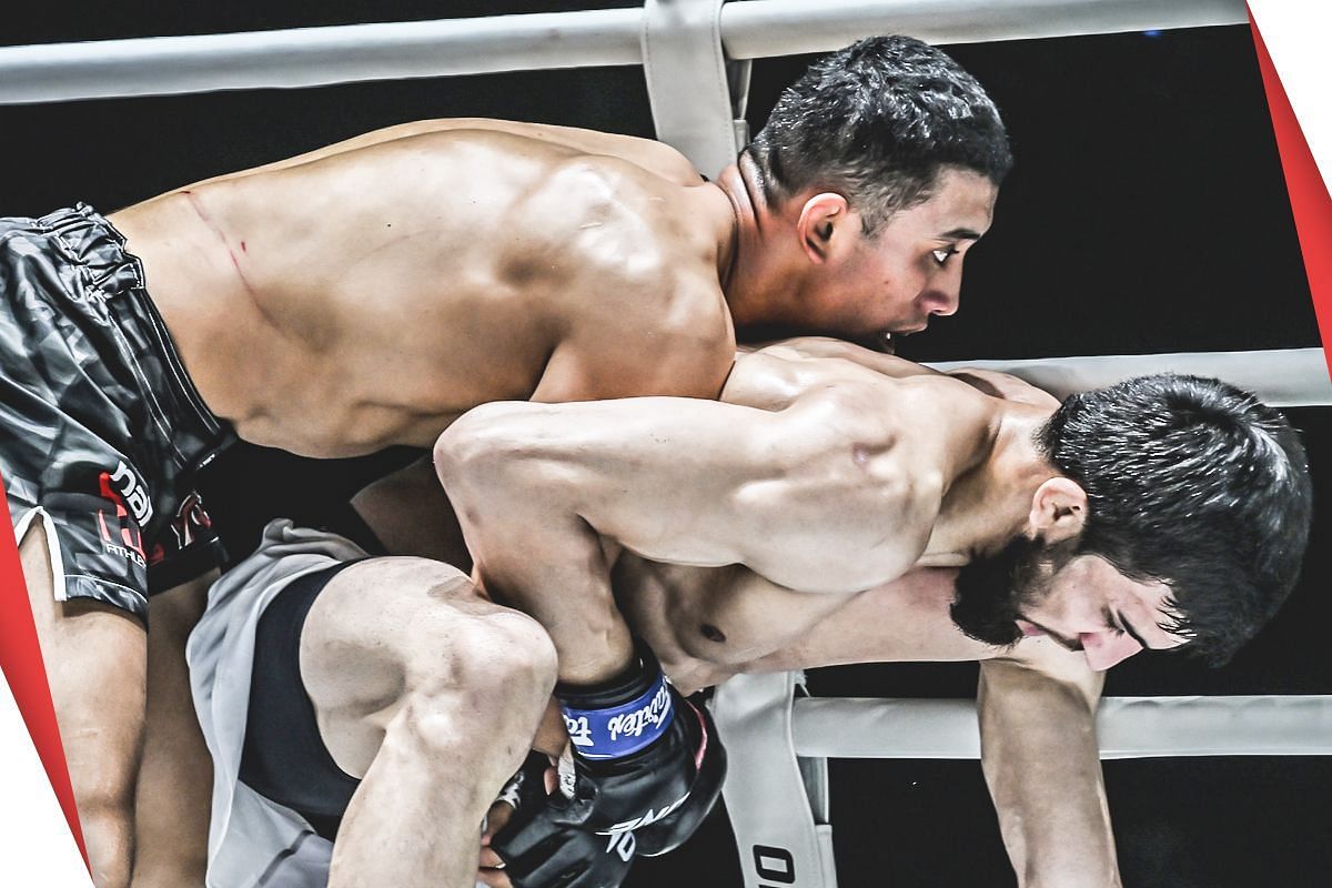 Akbar Abdullaev (top) putting in the work against Halil Amir.