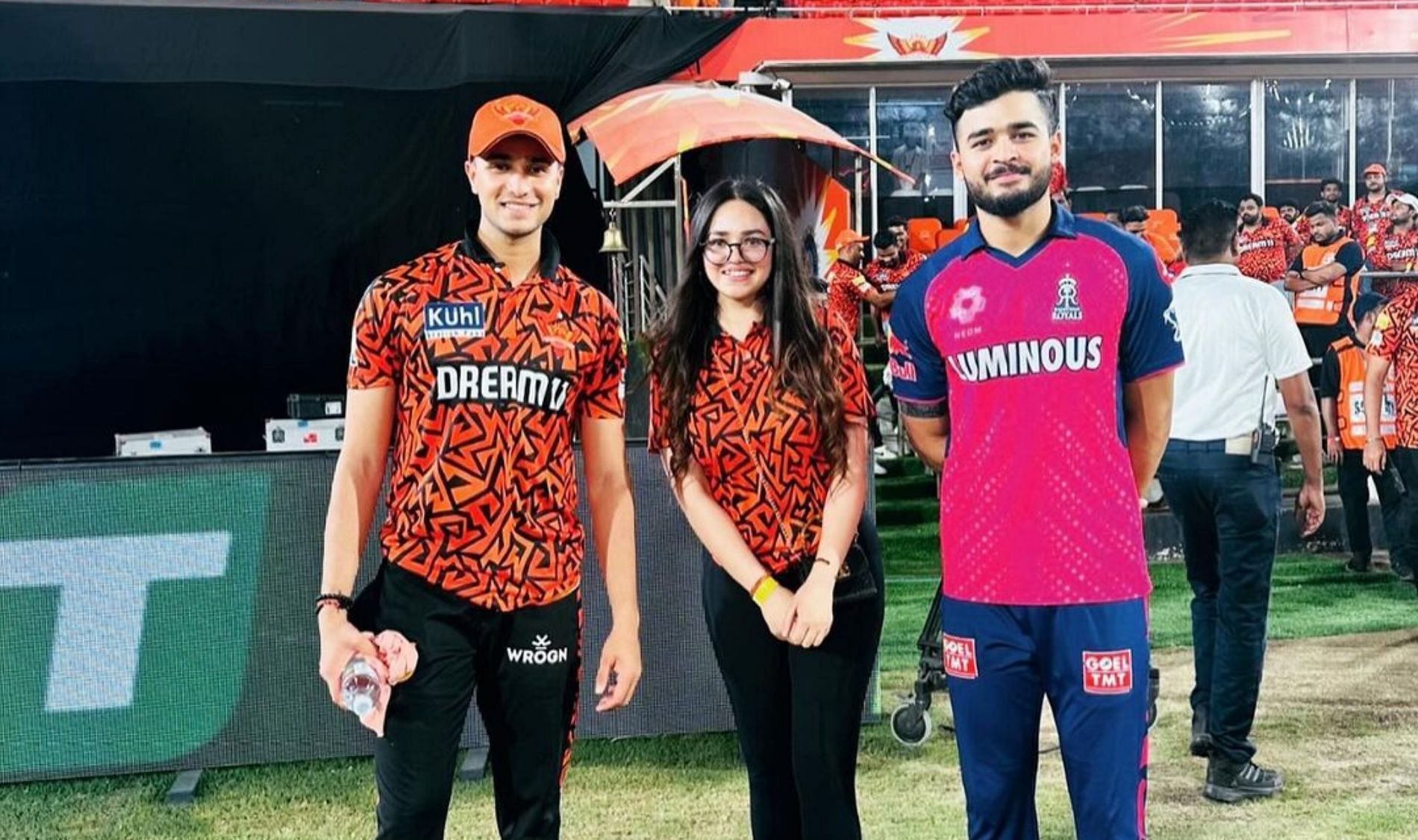 Komal Sharma with Abhishek Sharma (left) and Riyan Parag (right); (Image Credit: Dr. Komal Sharma/ Instagram)