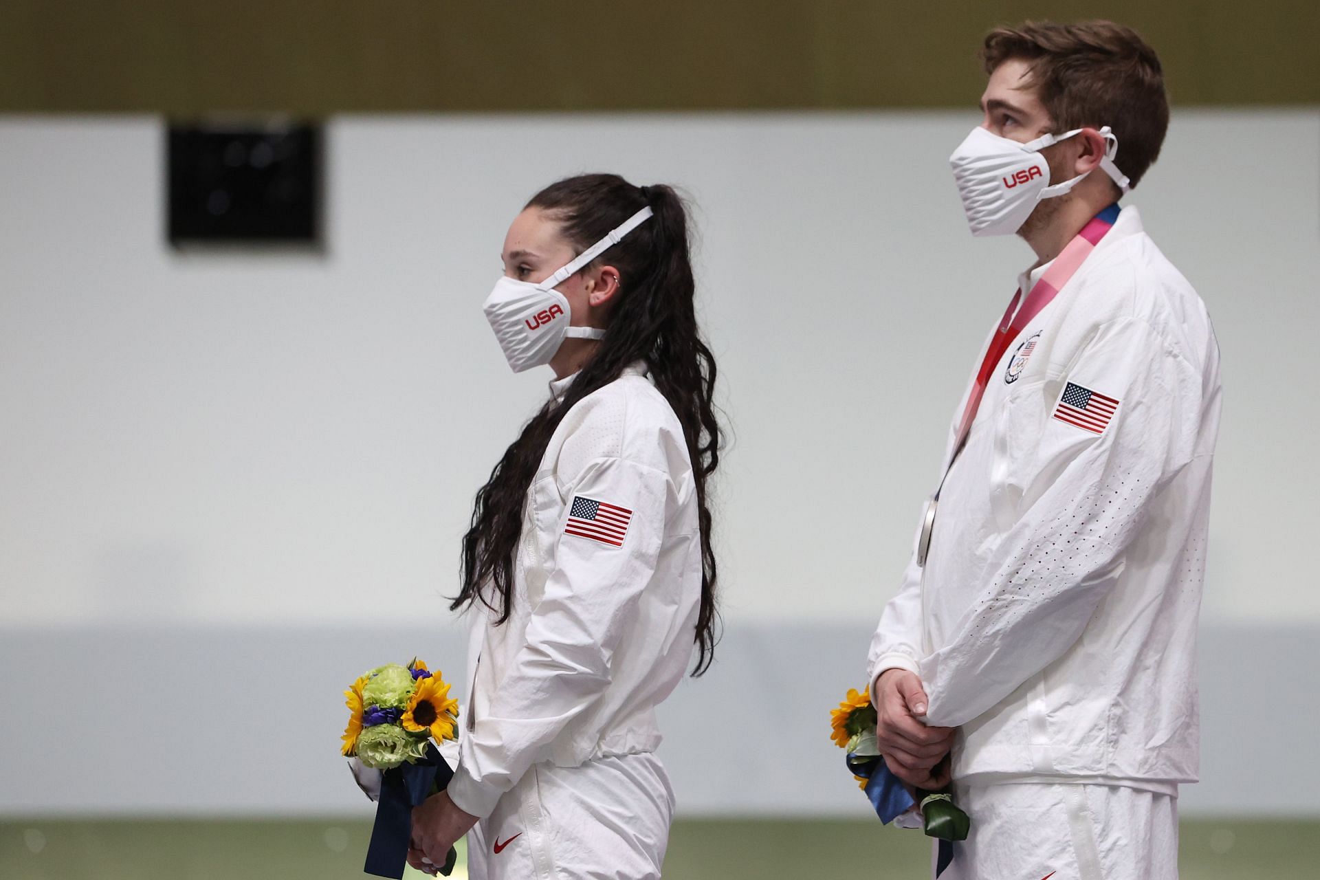 Lucas Kozeniesky (R) and Mary Tucker (L) during Tokyo Olympics medal ceremony.