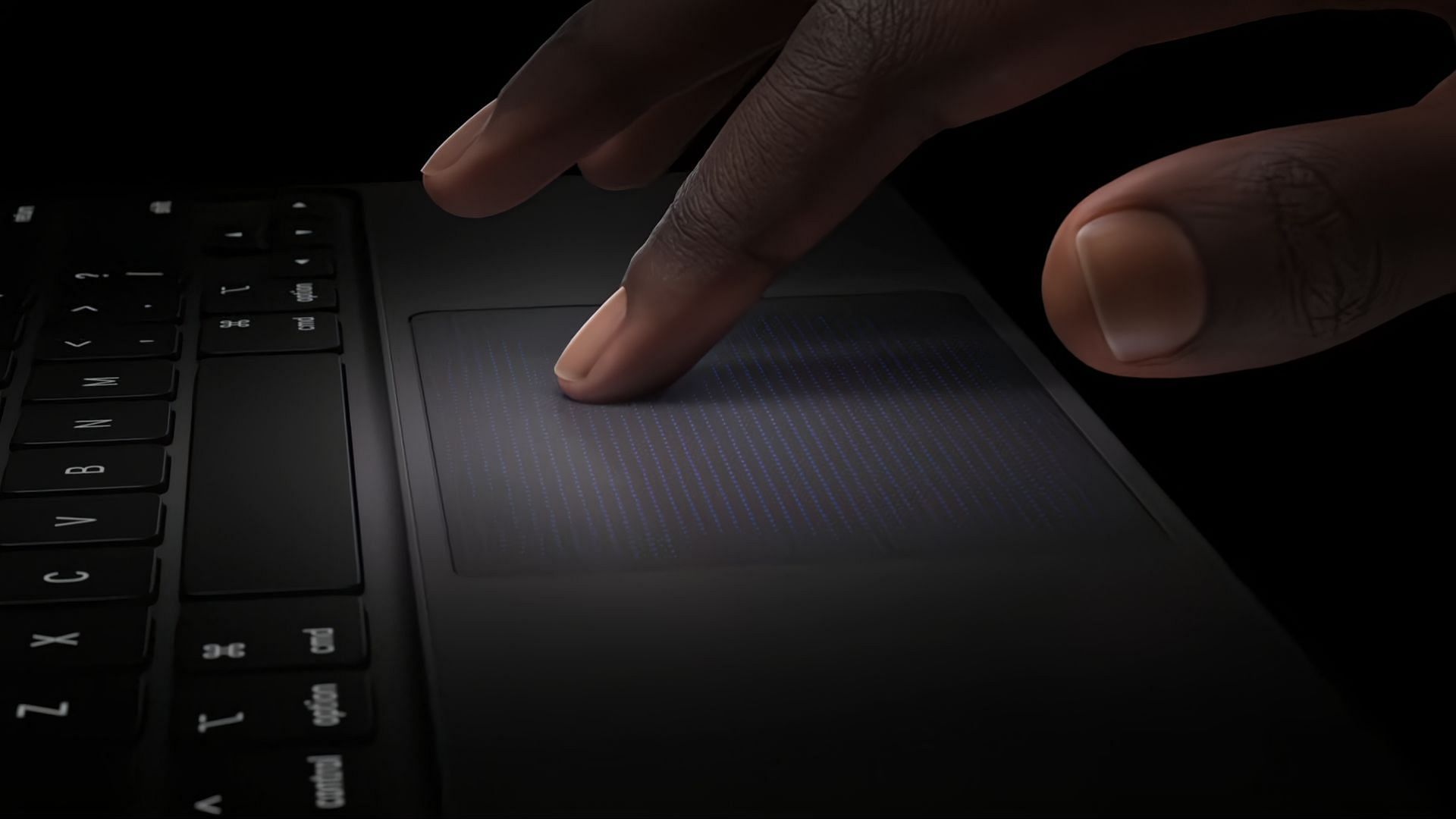 The new Magic Keyboard features a larger trackpad with support for haptic feedback (Image via Apple)