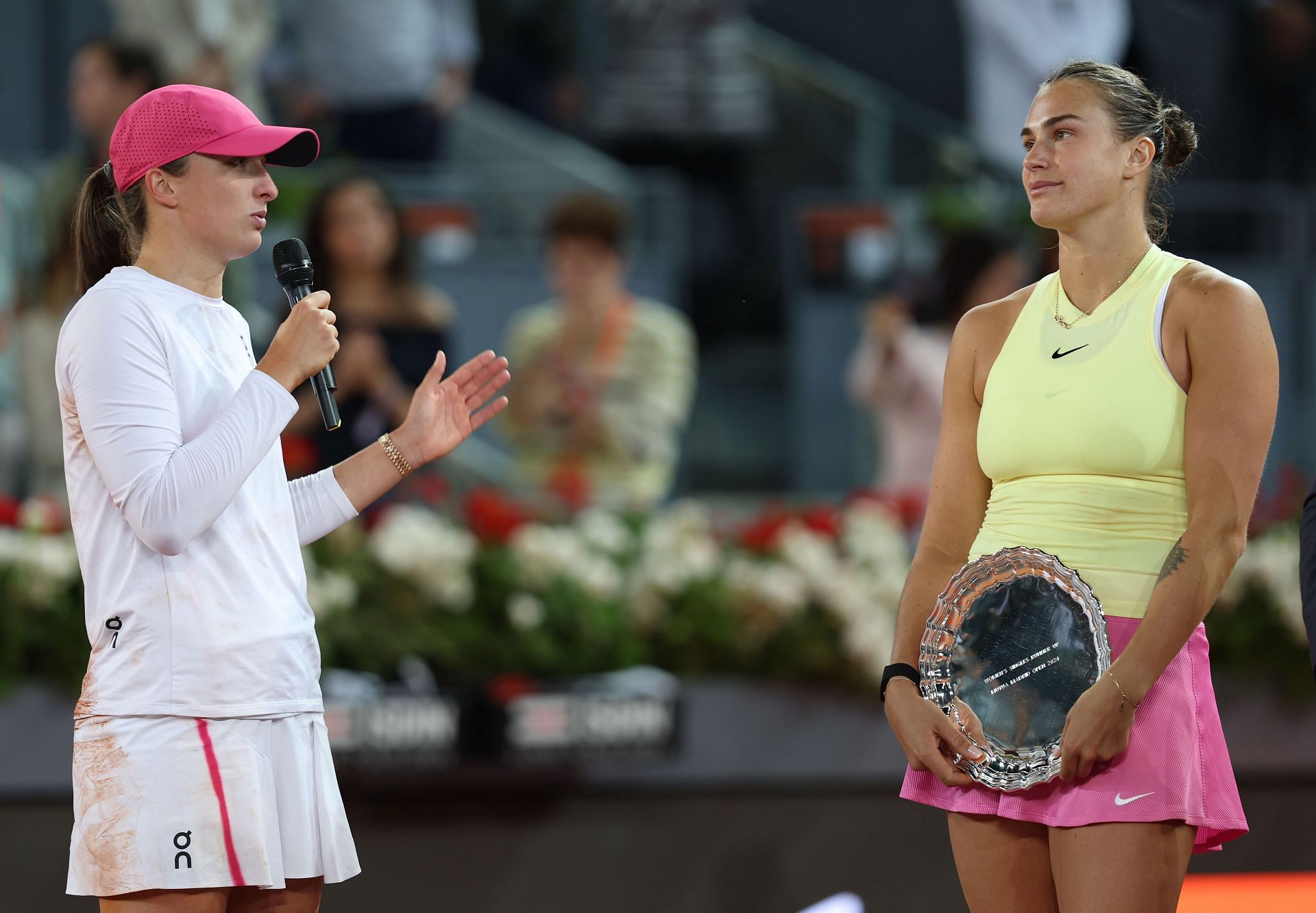 Iga Swiatek (L) and Aryna Sabalenka (R) during the trophy presentation ceremony after the conclusion of the women&#039;s singles final at the 2024 Madrid Open