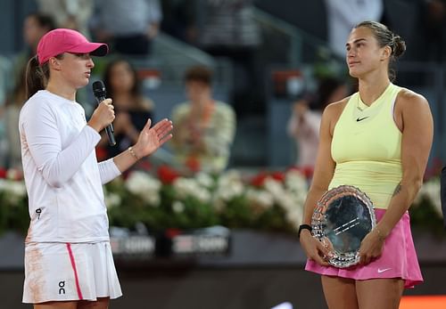 Iga Swiatek (L) and Aryna Sabalenka (R) during the trophy presentation ceremony after the conclusion of the women's singles final at the 2024 Madrid Open