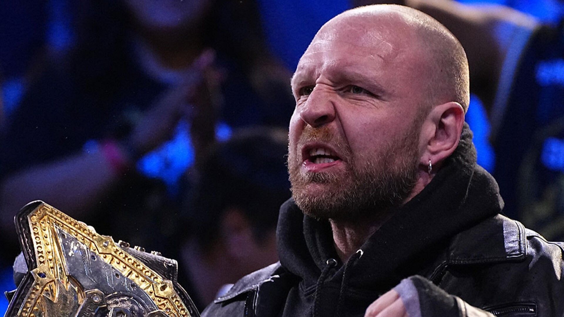 Jon Moxley on AEW Dynamite with the IWGP World Heavyweight Championship
