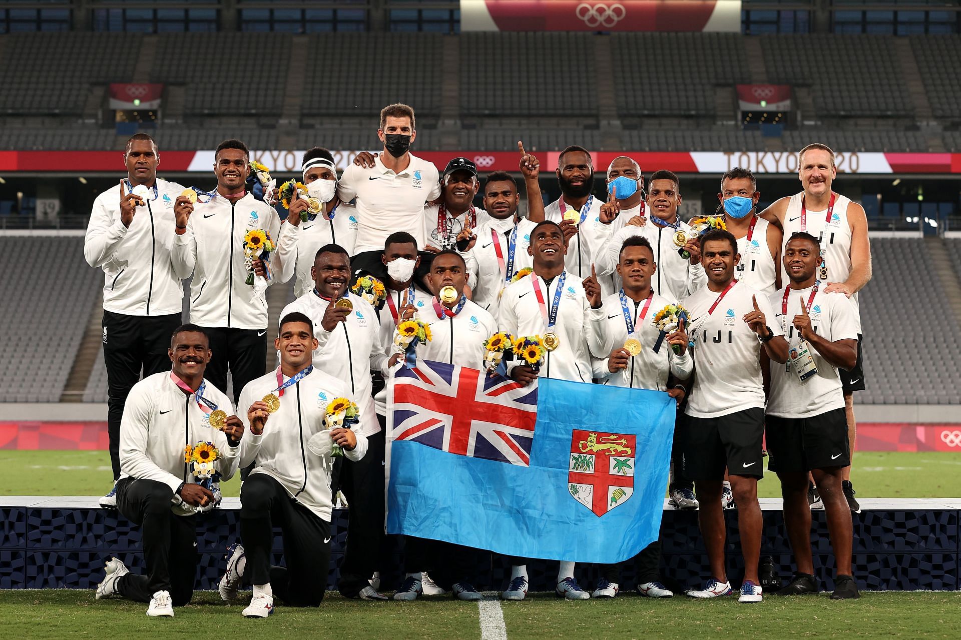 Team Fiji pose with their gold medals after winning the Rugby Sevens Men&#039;s Gold Medal match at the 2020 Tokyo Olympics. (Photo by Dan Mullan/Getty Images)
