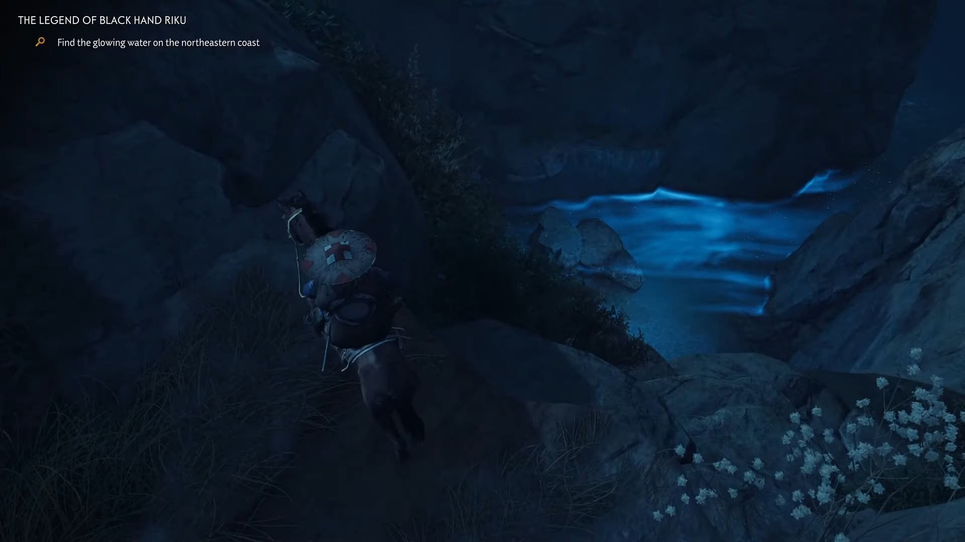 You&#039;ll be able to spot the glowing river if you look down from the cliff (Image via Sucker Punch || YouTube/Gooshy Gaming)