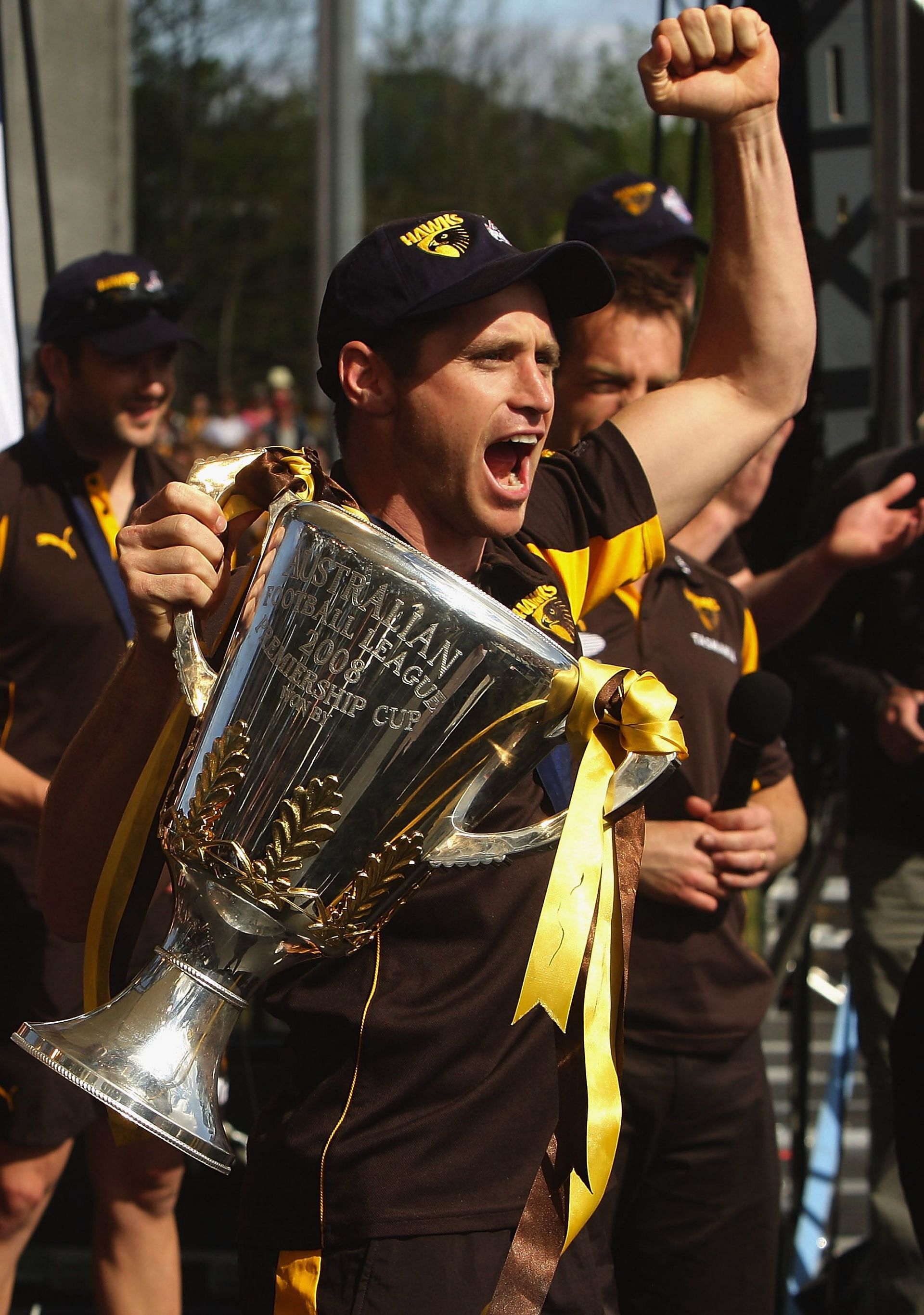 Shane Crawford of the Hawks holds up the 2008 AFL Premiership Cup