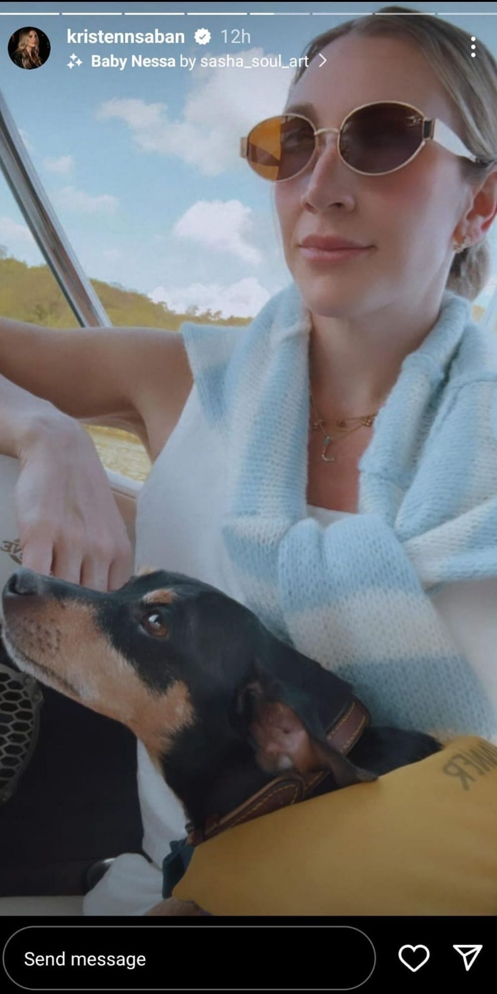 Kristen's furry friend with her on the boat ride. (Instagram/ Kristen)