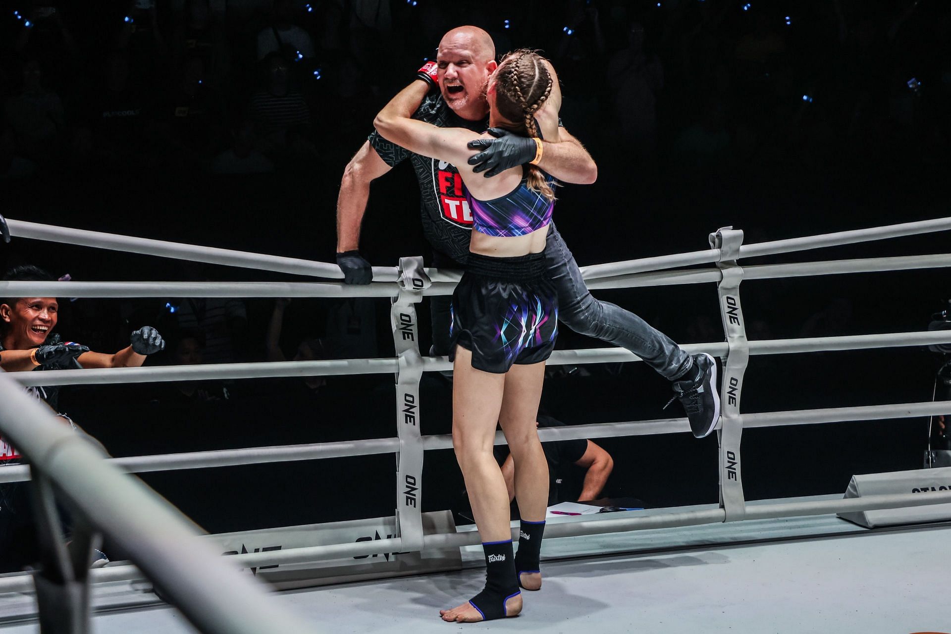 Smilla Sundell hugs her father Christofer after her victory at ONE Fight Night 22.
