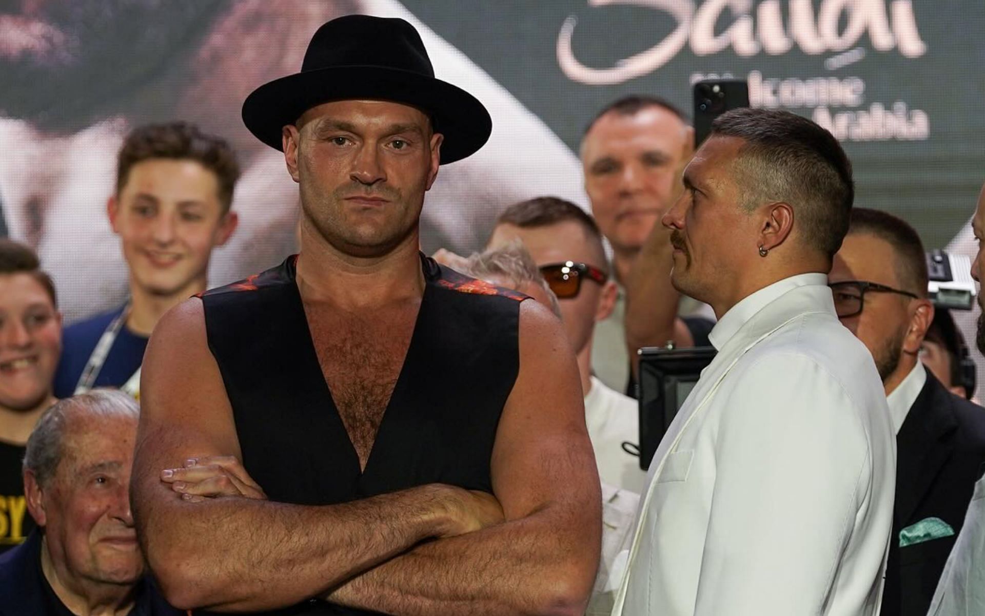 Tyson Fury (left) comments on his refusal to look at Oleksandr Usyk (right) during the Ring of Fire face-off [Photo Courtesy @tysonfury on Instagram]