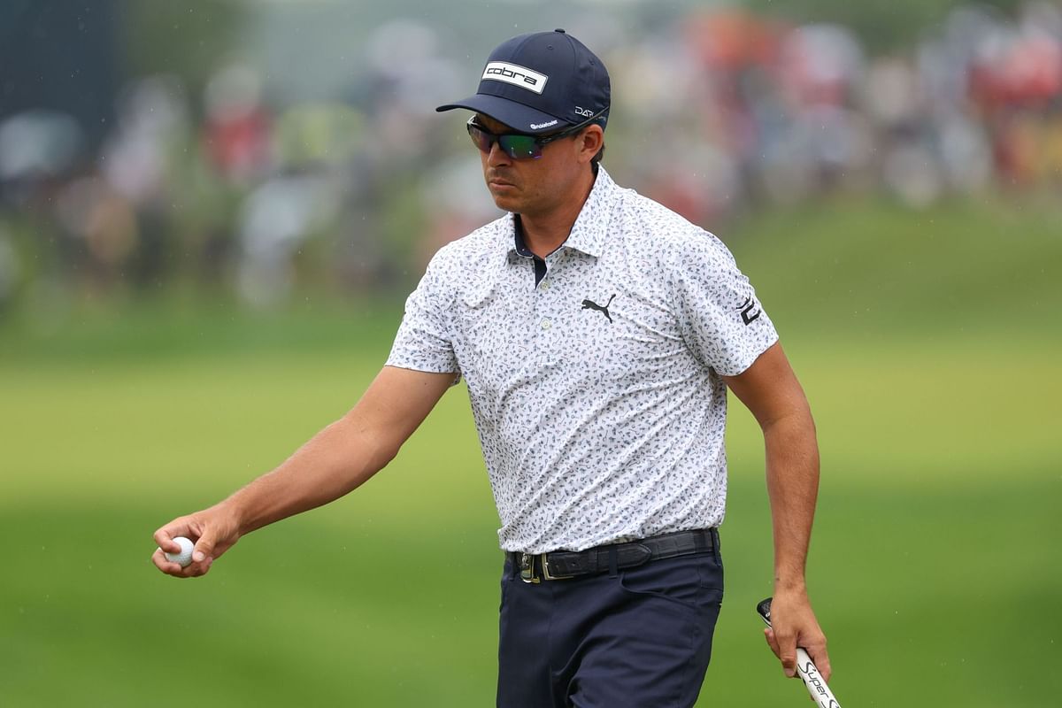 Why does Rickie Fowler wear sunglasses while playing?