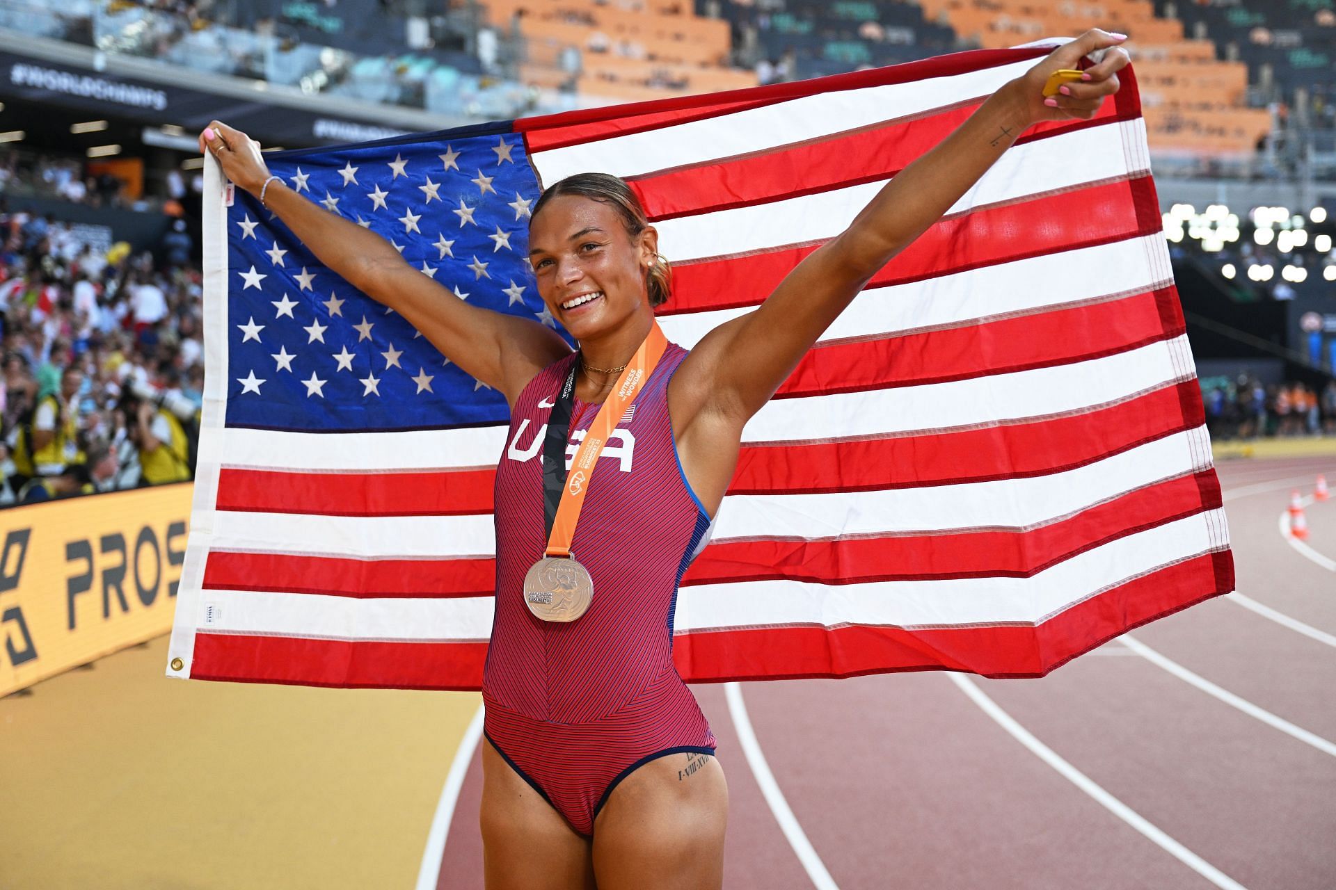 Silver medalist Anna Hall of Team United States celebrates with a United States flag after finishing second in the Women&#039;s 800m Heptathlon final during day two of the World Athletics Championships Budapest 2023 at National Athletics Centre on August 20, 2023 in Budapest, Hungary. (Photo by David Ramos/Getty Images)