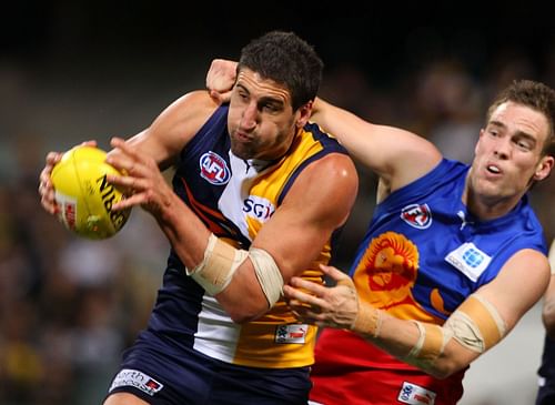 Dean Cox of the Eagles marks the ball