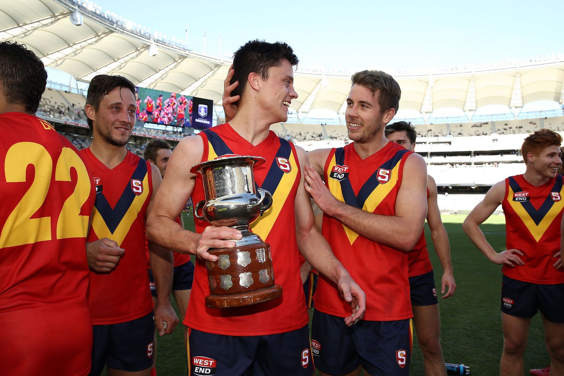 Jack Stephens of the SANFL carries the Haydn Bunton Trophy